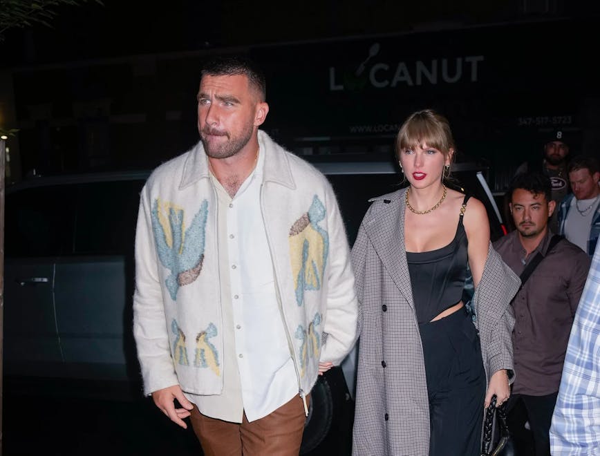 travis kelce and taylor swift holding hands; taylor swift outfits